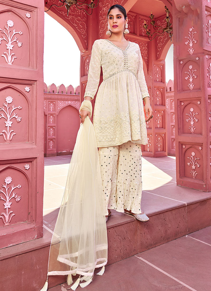 Indian Dresses - Black Sequence Embroidery Peplum Style Sharara Suit At Hatkay Buy Latest Indian Outfits With Free Shipping.