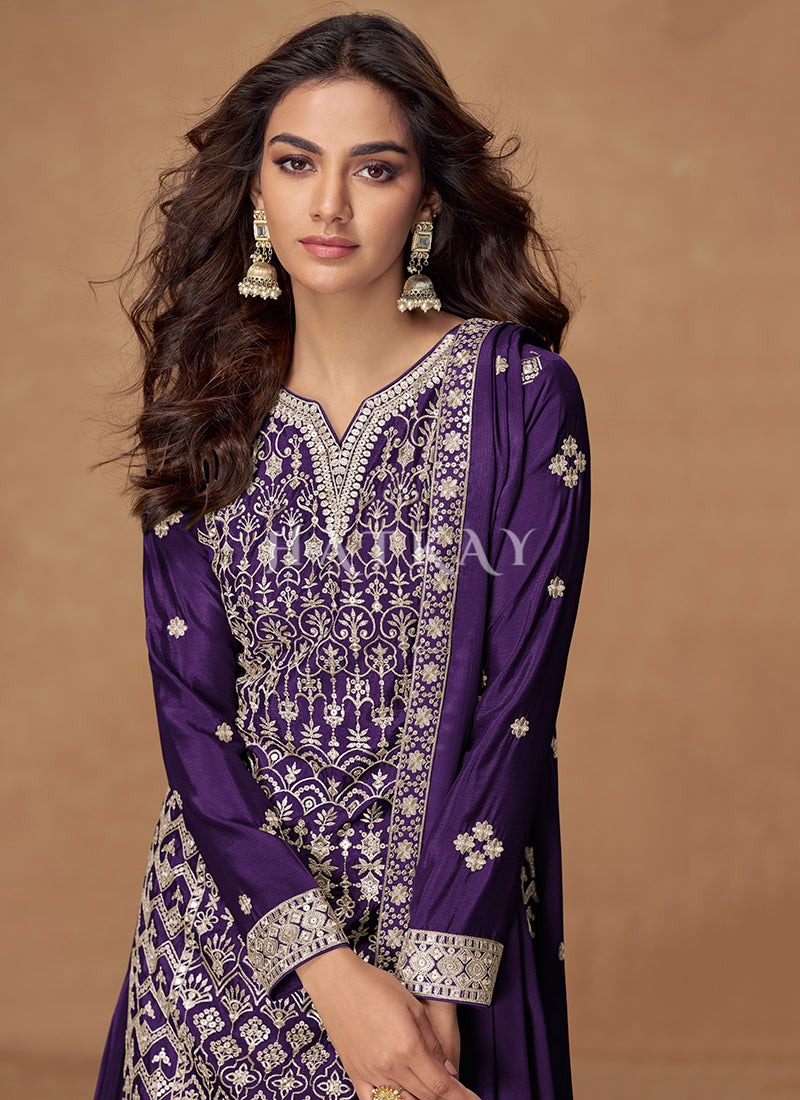 Woman wearing a purple embroidered traditional outfit In Canada