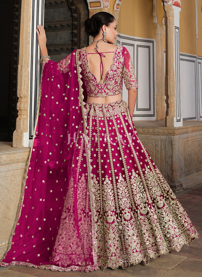 Add a touch of glitz and glamor to your traditional outfit collection with the gorgeous and bold lehenga choli from Hatkay's designer Indian collection.