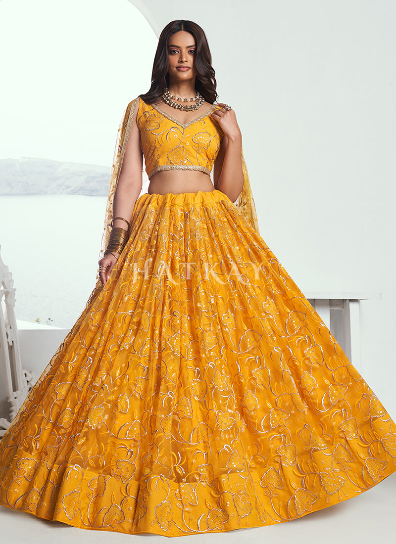 Add a touch of glitz and glamor to your traditional outfit collection with the gorgeous and bold lehenga choli from Hatkay's designer Indian collection.