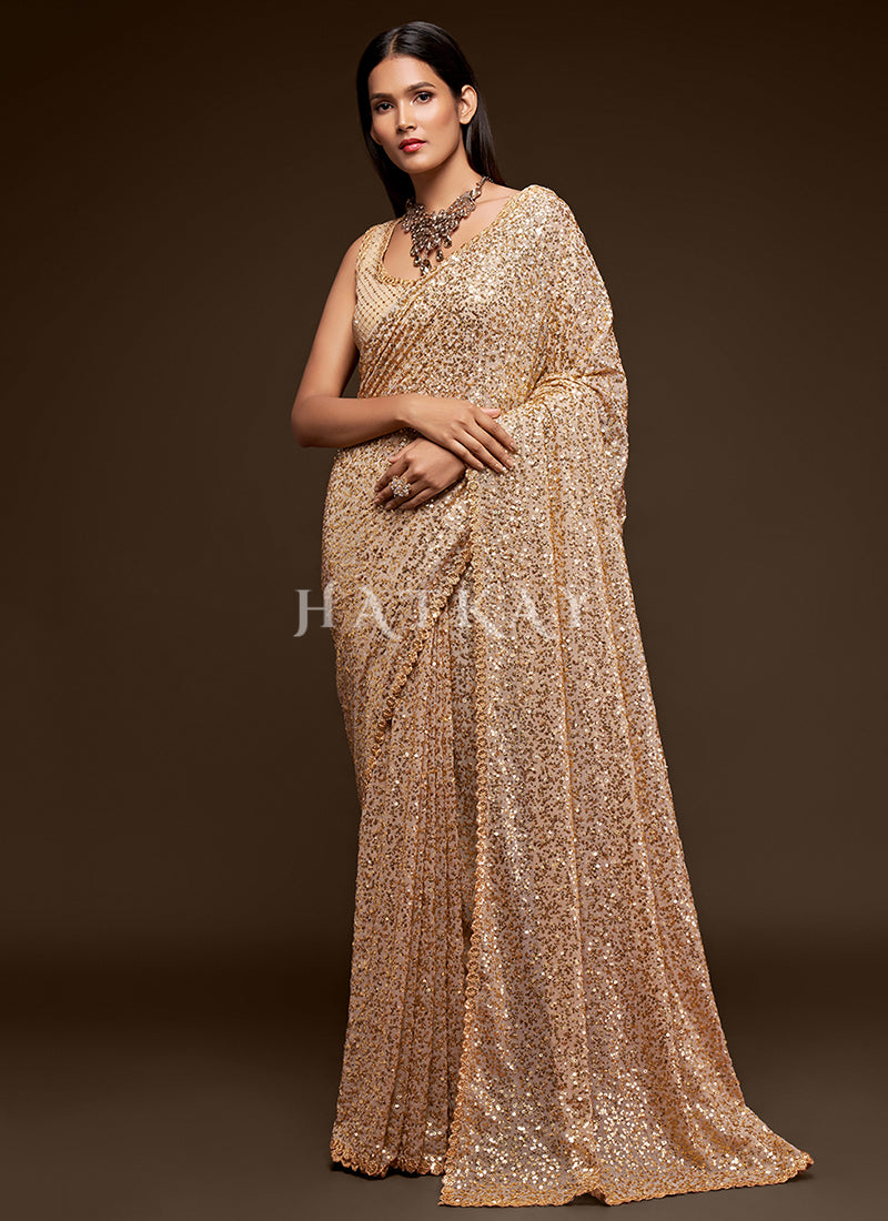 Saree Online - Choose from the unique range of sarees at best price. Shop for saree, wedding saree & more in various fabric options at Hatkay.