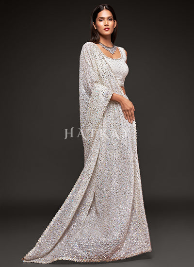 Dive into elegance with our exquisite collection of wedding sarees at Hatkay. Crafted with intricate details and luxurious fabrics.