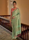 Teal And Peach Weaved Crape Silk Saree