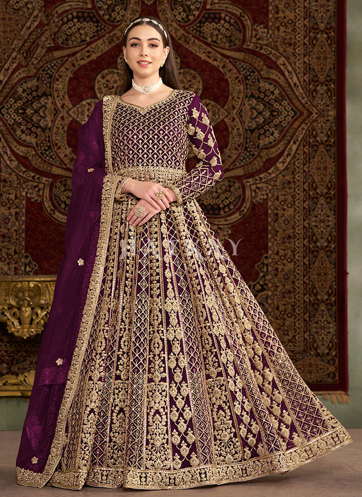 dark purple anarkali dress Embrace festive elegance this Diwali with this stunning deep purple Anarkali dress. Featuring intricate silver embroidery and delicate embellishments, this dress is perfect for adding a touch of tradition and style to