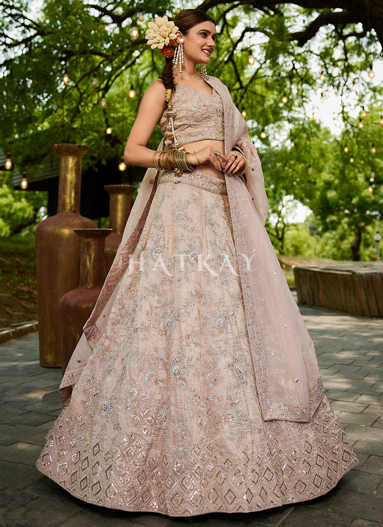 peach and gold indian wedding dress A peach-gold dream that glows in every light. Hand-embroidered sequins, intricate motifs and a silhouette that flatters every bride this lehenga is elegance without effort. Perfect for engagement, cocktail or reception