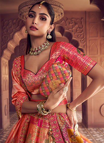 Coral Peach and Pink Embroidered Bridal Lehenga Choli