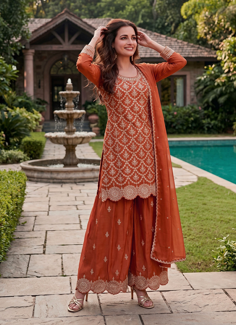 Ethnic rust orange embroidered Chinnon palazzo suit.