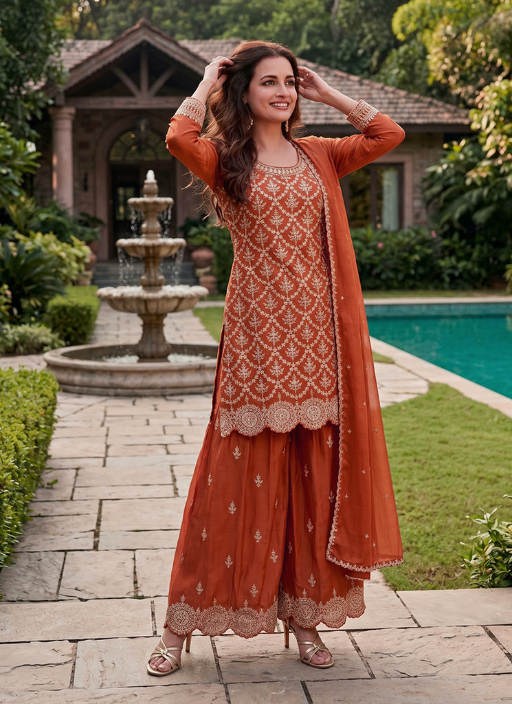 Ethnic rust orange embroidered Chinnon palazzo suit.