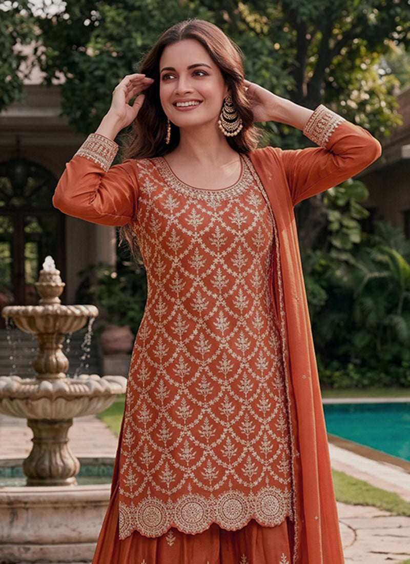 Women's rust orange embroidered Chinnon suit.