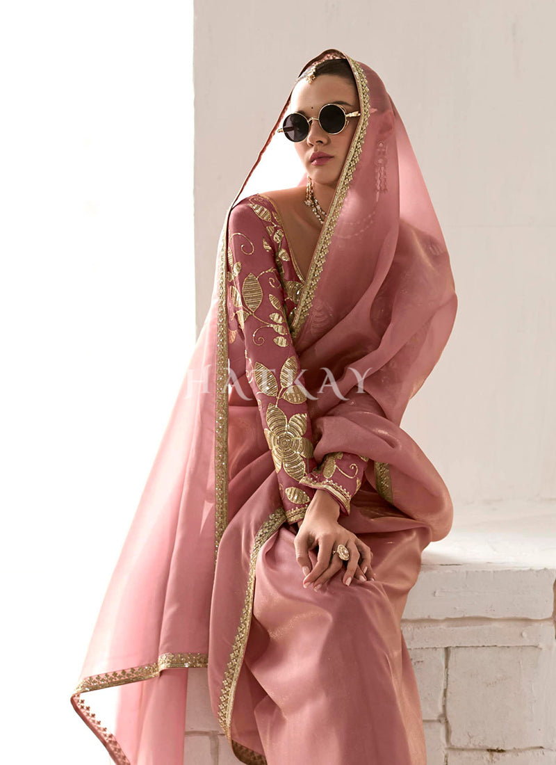 Stay stylish and trendy with a variety of wedding wear saree options at the best price.