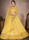 Yellow Mirror Work Embroidery Net Lehenga Choli