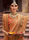 Golden Beige And Orange Zari Embroidered Saree